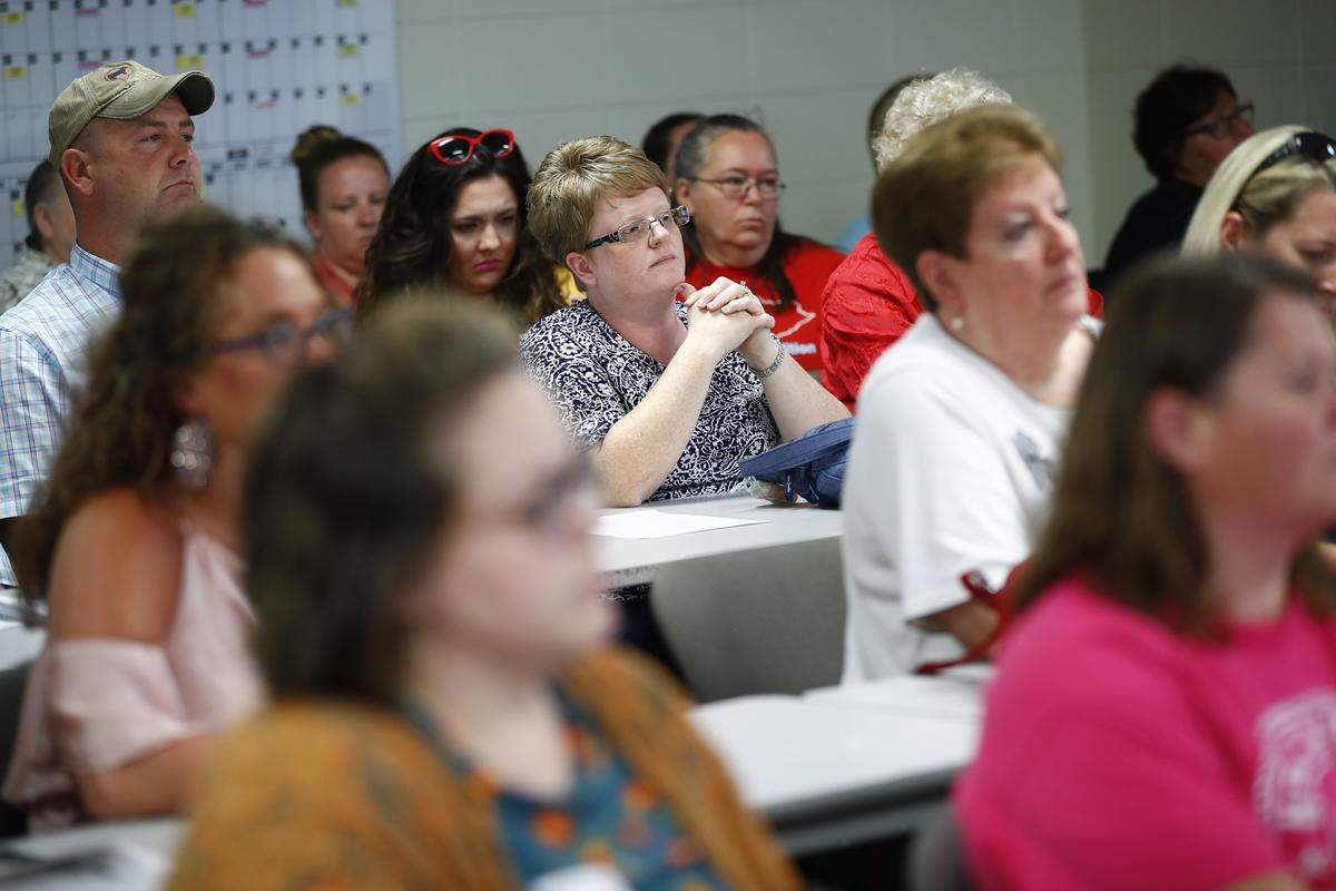 Cindy Wesley, of Waynesburg, Ky., center, mother of a fifth grade student at Lincoln County Middle School, and other parents attend a Lincoln County School Board at the Lincoln County Student Support Center in Stanford, Ky., Thursday, June 20, 2019. The school board announced an additional review of the proposed Summit Learning program will begin before implementation.