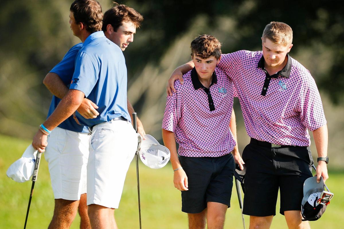 Madison Central’s Gavin McKune and Clay Pendergrass, from left, celebrate near Lexington Christian’s Grey Goff and Luke Barrett during the Region 9 boys’ golf championship at Gibson Bay Golf Course in Richmond on Tuesday.