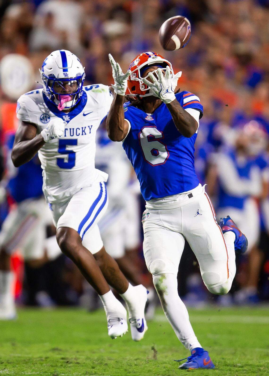 Florida wide receiver Elijhah Badger (6) hauls in a pass against Kentucky defensive back DJ Waller Jr. (5).