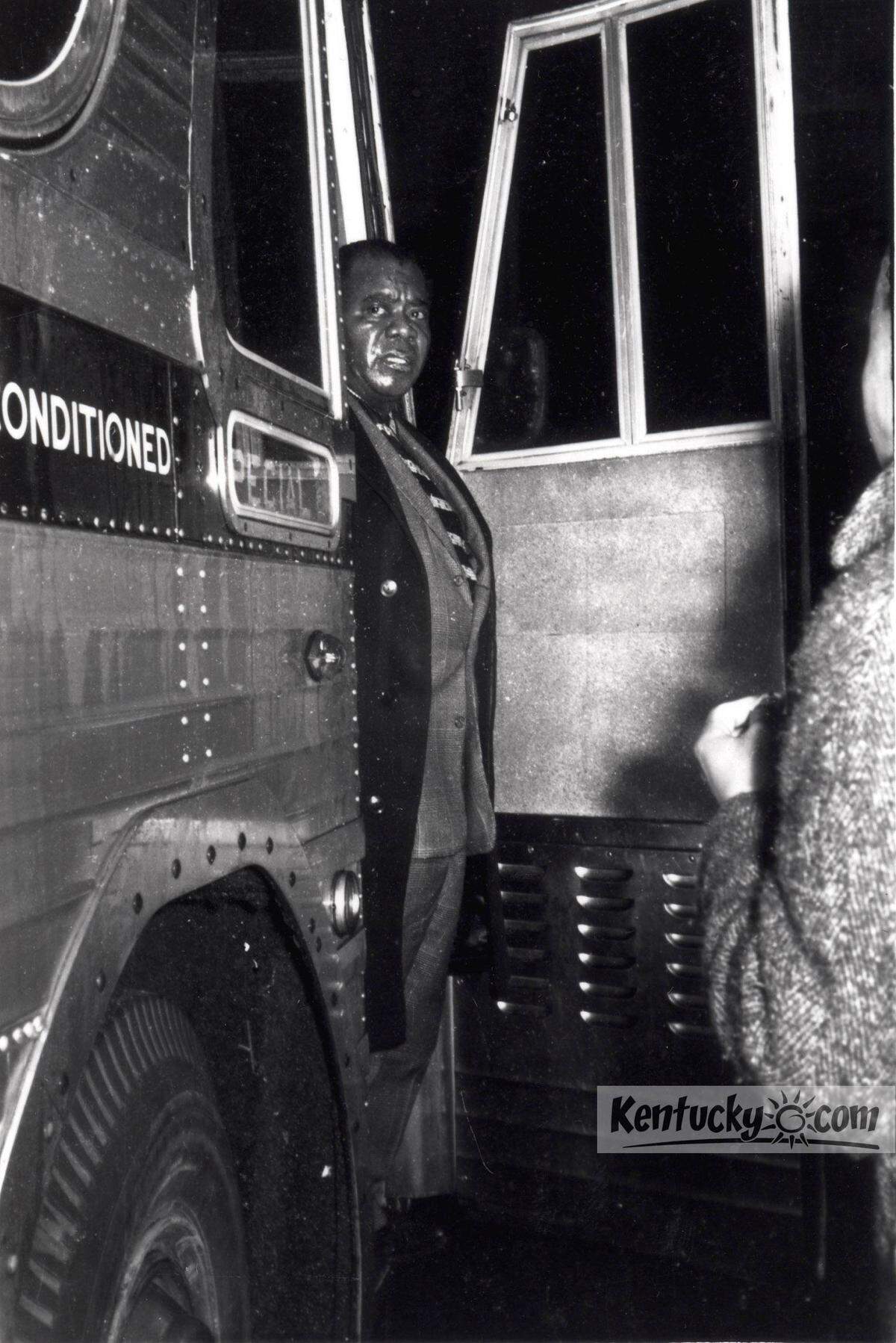 Louis Armstrong arriving at the Phoenix Hotel in downtown Lexington, Ky., in  December 1961. Armstrong came to Lexington to perform at a private party at  the hotel and upon his arrival he was met with demonstrators protesting the hotel's discriminatory policies and he refused to cross the picket line. Not  wanting Armstrong to be sued for breaking a contract, demonstrators disbanded  so he could cross the picket line.  Photo Courtesy Calvert McCann
