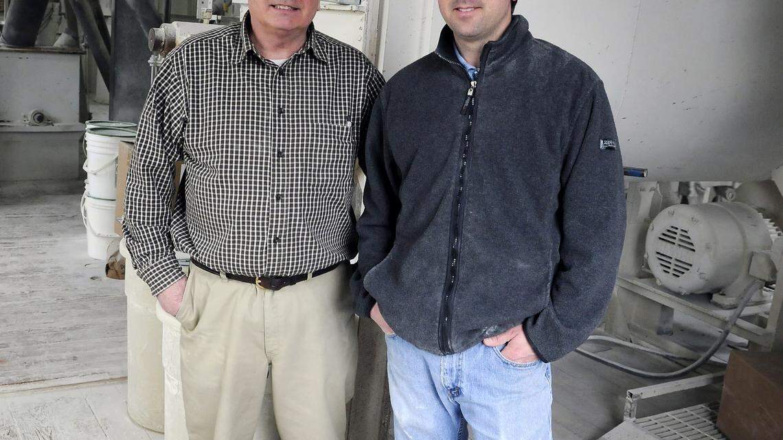 Mac Weisenberger, left, and his son Philip are the fifth and sixth generations to run the mill. 