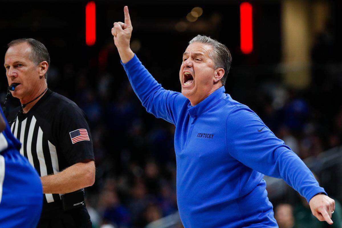 Kentucky Wildcats head coach John Calipari shouts to his players in double overtime against the Michigan State Spartans during the State Farm Champions Classic.
