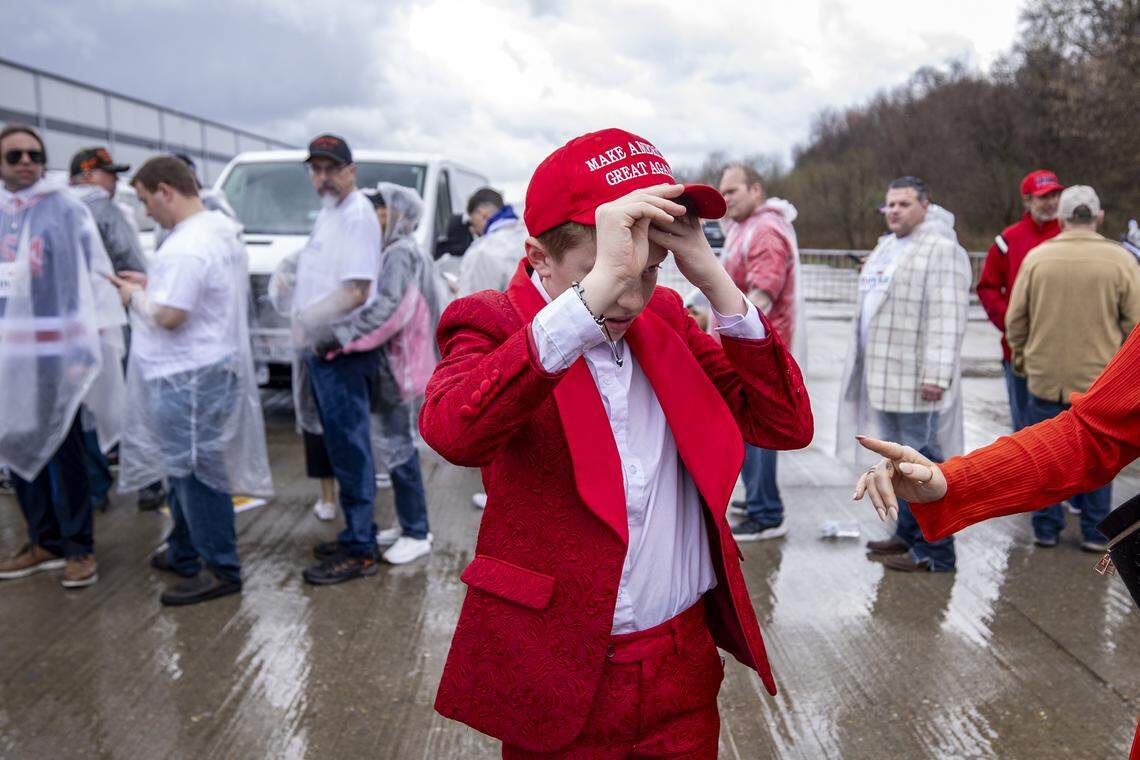 Tanner Harris fixes his hair before posing for a photo during President Donald Trump’s visit at Verst Logistics in Hebron, Kentucky, on Wednesday, March 11, 2026.