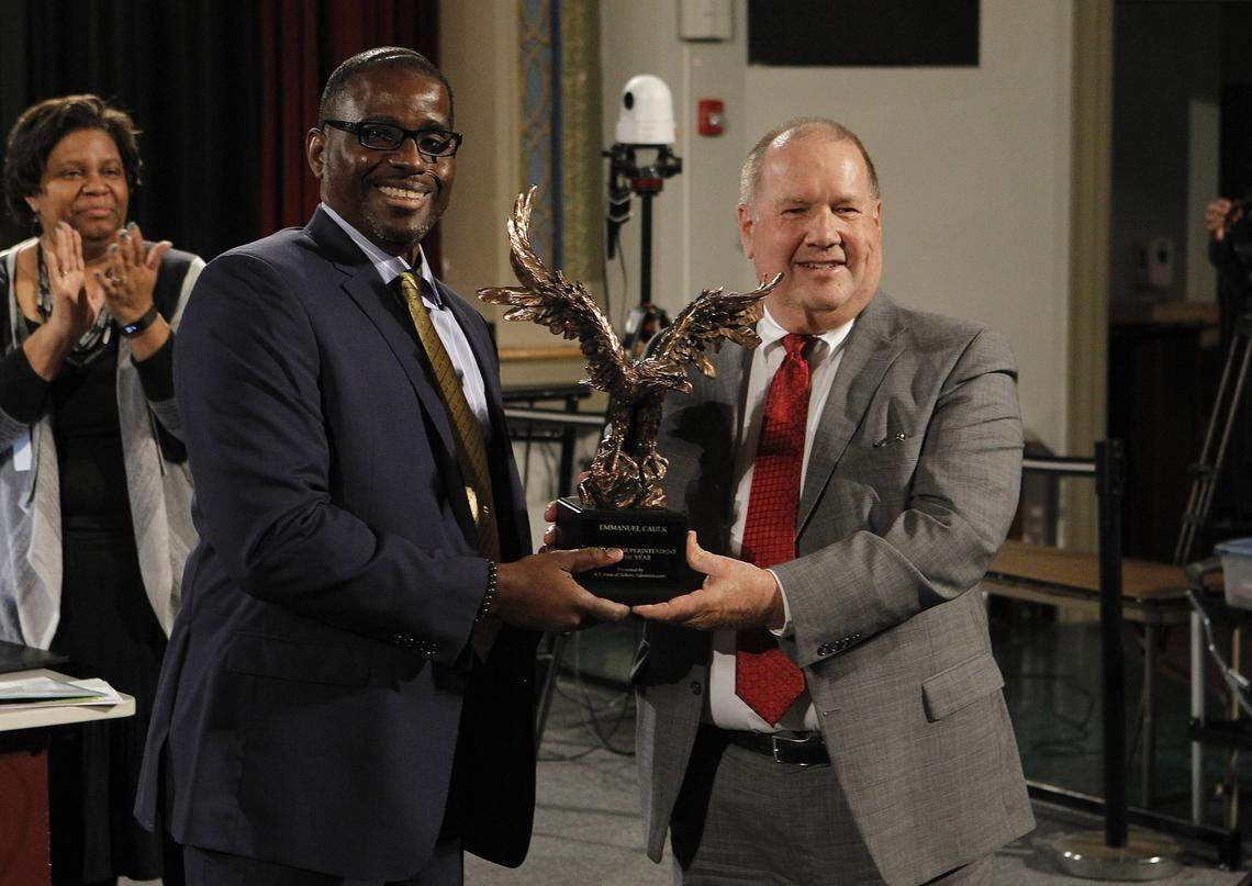 Wayne Young, executive director of Kentucky Association of School Administrators, presented the Kentucky Superintendent of the Year Award in 2018 to Manny Caulk, superintendent of Fayette County Public Schools.