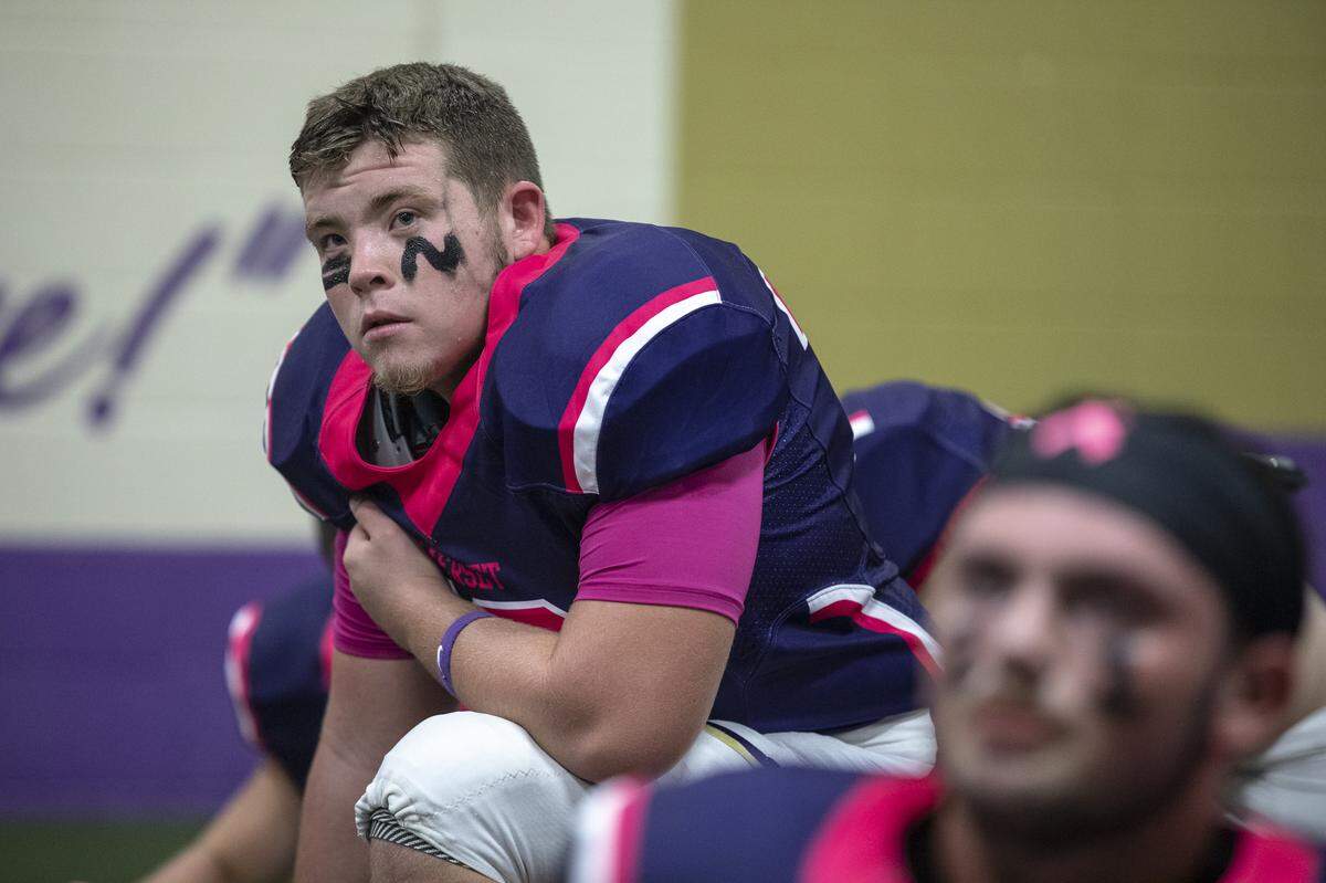 Jackson Prather, left, a senior, listens as Somerset coaches talk to the team before the game.