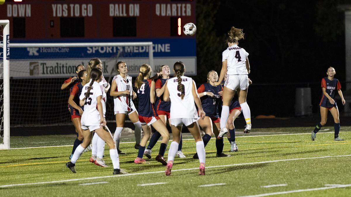 Paul Laurence Dunbar’s Kennedy Morgan (4) rises high for a goal-scoring header during the Bulldogs’ 4-0 win over Lafayette High School on Monday.