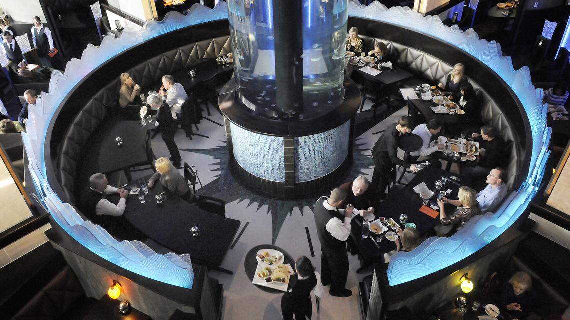 At the center of Coba Cocina restaurant is a tank, 18 feet tall and six feet in diameter, containing more than 300 jellyfish. The restaurant, which opens Monday, had several preview events last week.   Photo by Tom Eblen | Staff