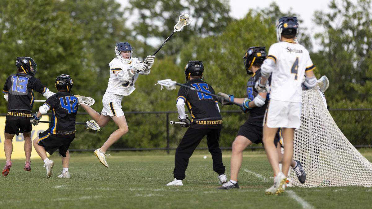 Sayre’s Will Moore (31) fires a shot over Henry Clay goalie Noah Gute during the Spartans’ 13-5 victory at Sayre Athletic Complex on Friday.