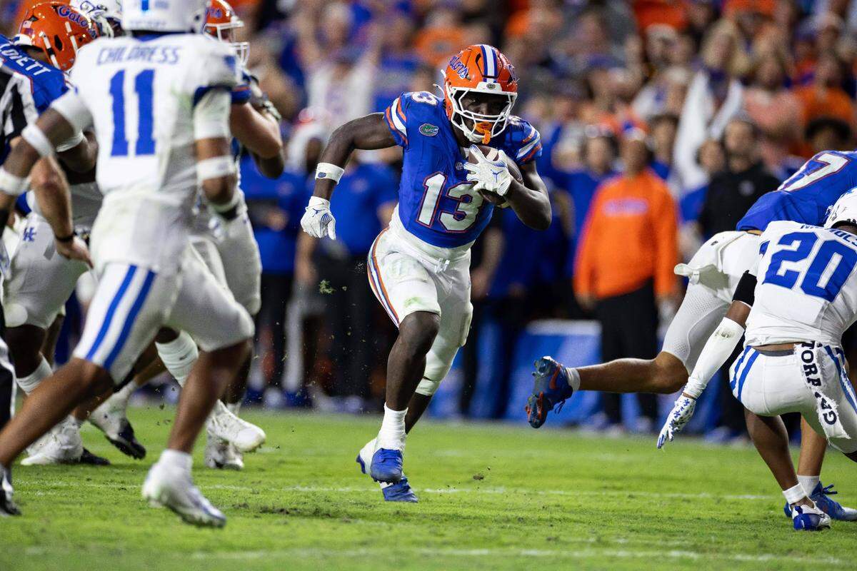 Oct 19, 2024; Gainesville, Florida, USA; Florida Gators running back Jadan Baugh (13) runs with the ball against the Kentucky Wildcats during the second half at Ben Hill Griffin Stadium. Mandatory Credit: Matt Pendleton-Imagn Images