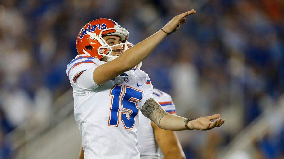 Florida Gators kicker Eddy Pineiro gives a Gator chomp toward the stands in his team’s win over Kentucky at Kroger Field last season. The No. 25 Gators host the Cats on Saturday.