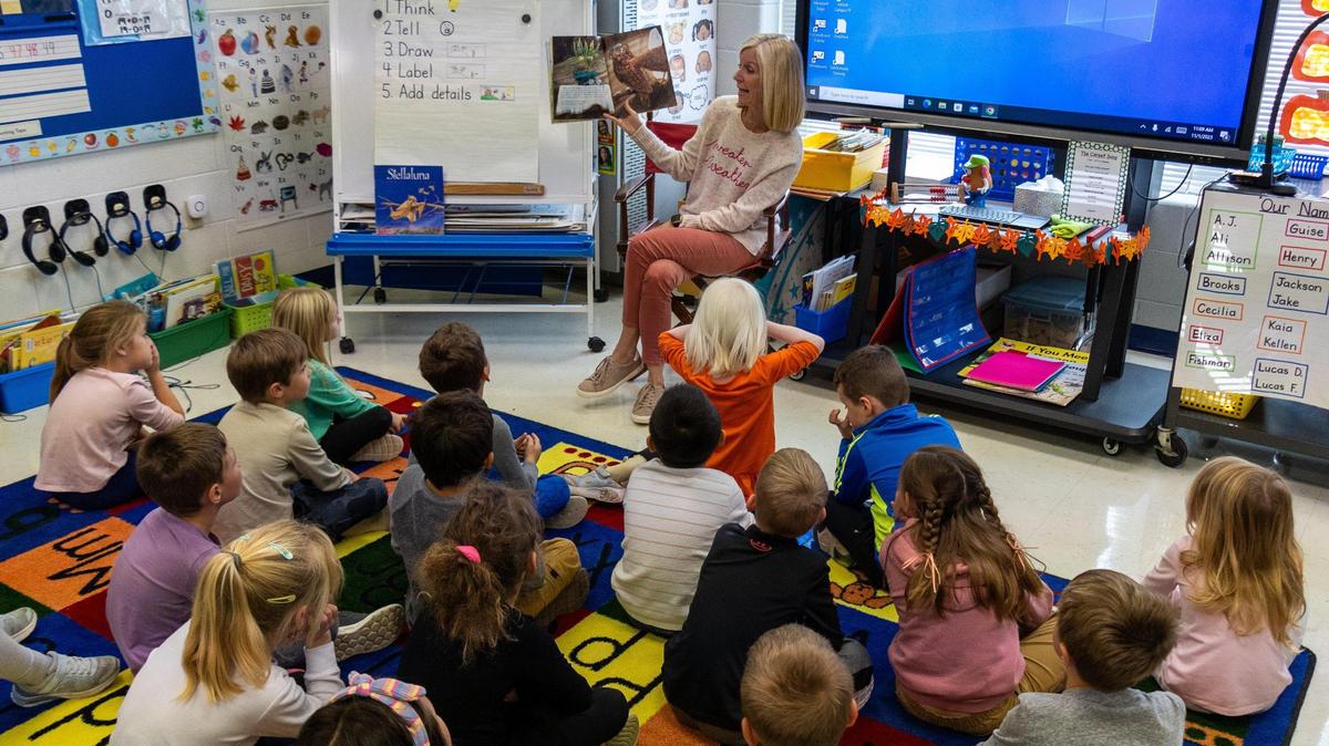 Tracie Guise, an Athens-Chilesburg Elementary school teacher, reads aloud from the book “The Scarecrow’s Hat” to her kindergarten class, Nov. 1, 2023.