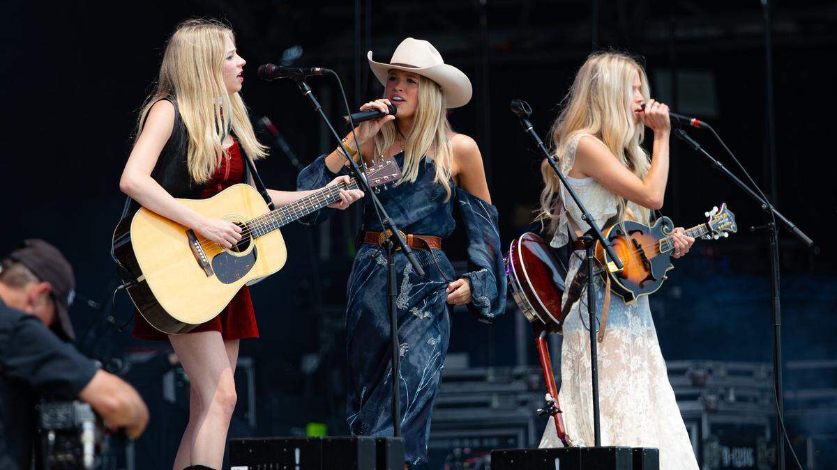 Neo-Traditional country music trio, The Castellows, is a band comprised of sisters Ellie (lead guitar), Powell (banjo), and Lily (vocals), performing during the 2025 Railbird music festival, at Red Mile infield on June 1, 2025, in Lexington, Ky.