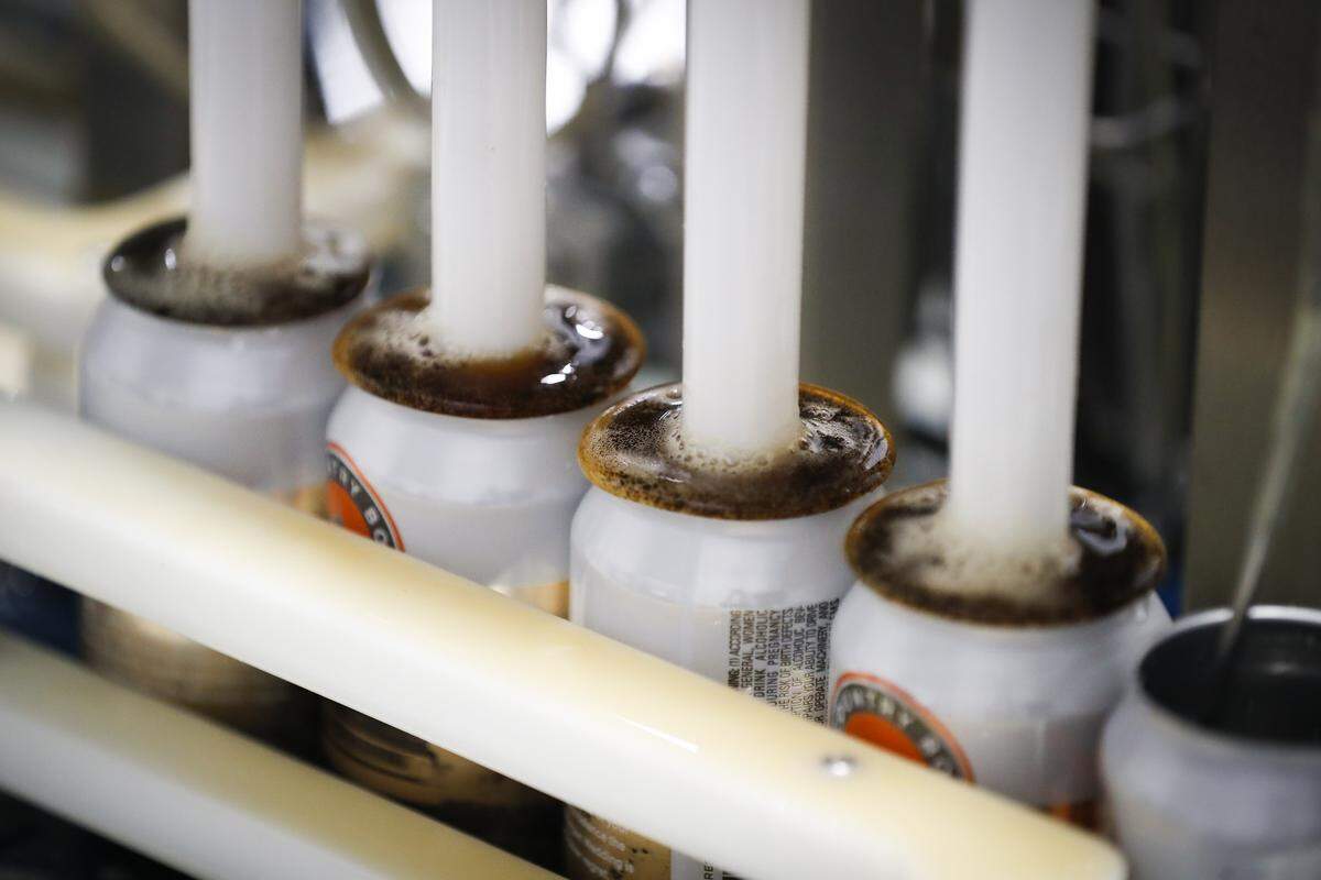 Cans of Shotgun Wedding are filled at Country Boy Brewing in Georgetown.