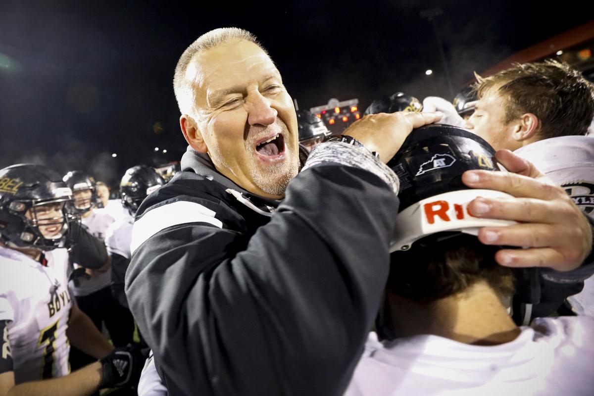 Boyle County’s head coach Chuck Smith celebrated with the team following the Class 3A region final against Belfry Friday at Belfry High School in Belfry, Ky. Boyle County beat Belfry 41-24.