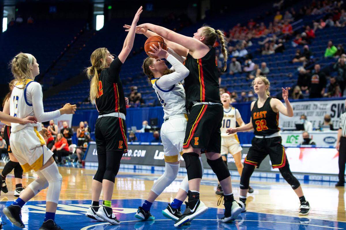 Bullitt East’s Gracie Merkle (44) blocks a shot during last year’s Sweet 16. Merkle leads the Chargers in scoring at 17.6 points per game and rebounding at 9.6.