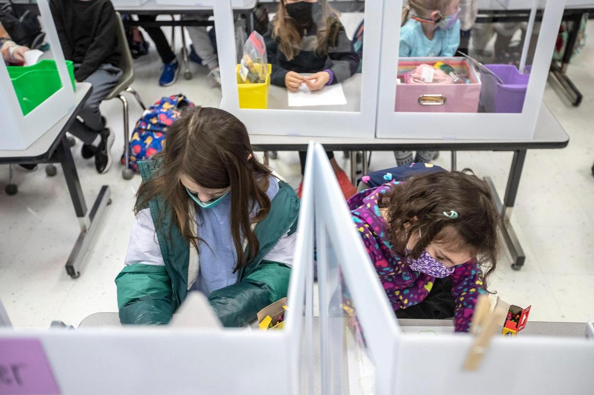 Students in Dani HellerÕs second grade class draw at Veterans Park Elementary School in Lexington, Ky., on Monday, Feb. 22, 2021. Monday was the first day of in-person classes this school year for kindergarten to second grade students at Fayette County Public Schools.