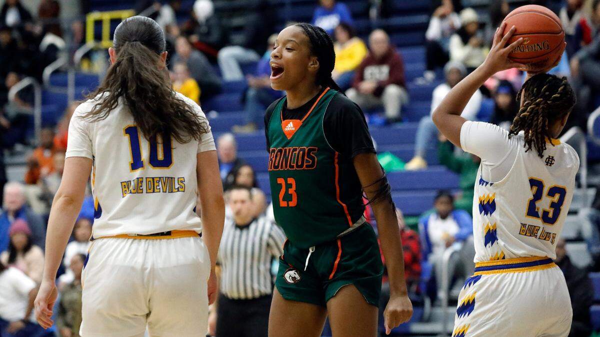 Frederick Douglass’ Jaelee Knowles (23) celebrates a second-half basket against Henry Clay on Jan. 5.
