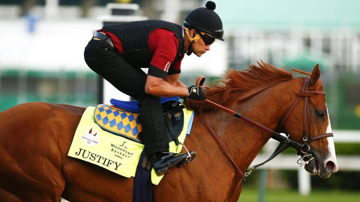 Justify, with exercise rider Beto Gomez up, during a morning training session Wednesday at Churchill Downs. 