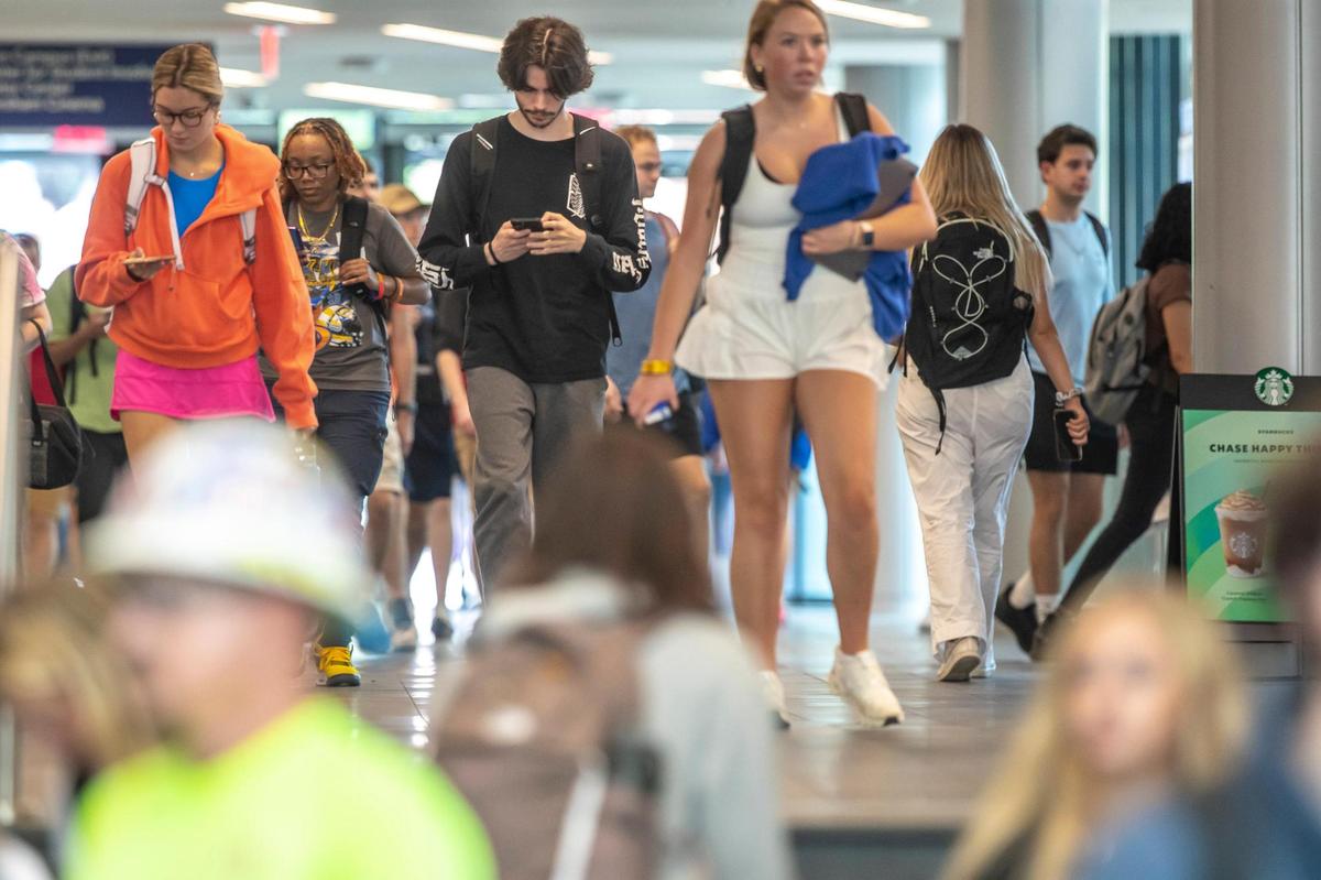 People walk through the Gatton Student Center on the University of Kentucky campus in Lexington, Ky., on Monday, Aug. 22, 2022.
