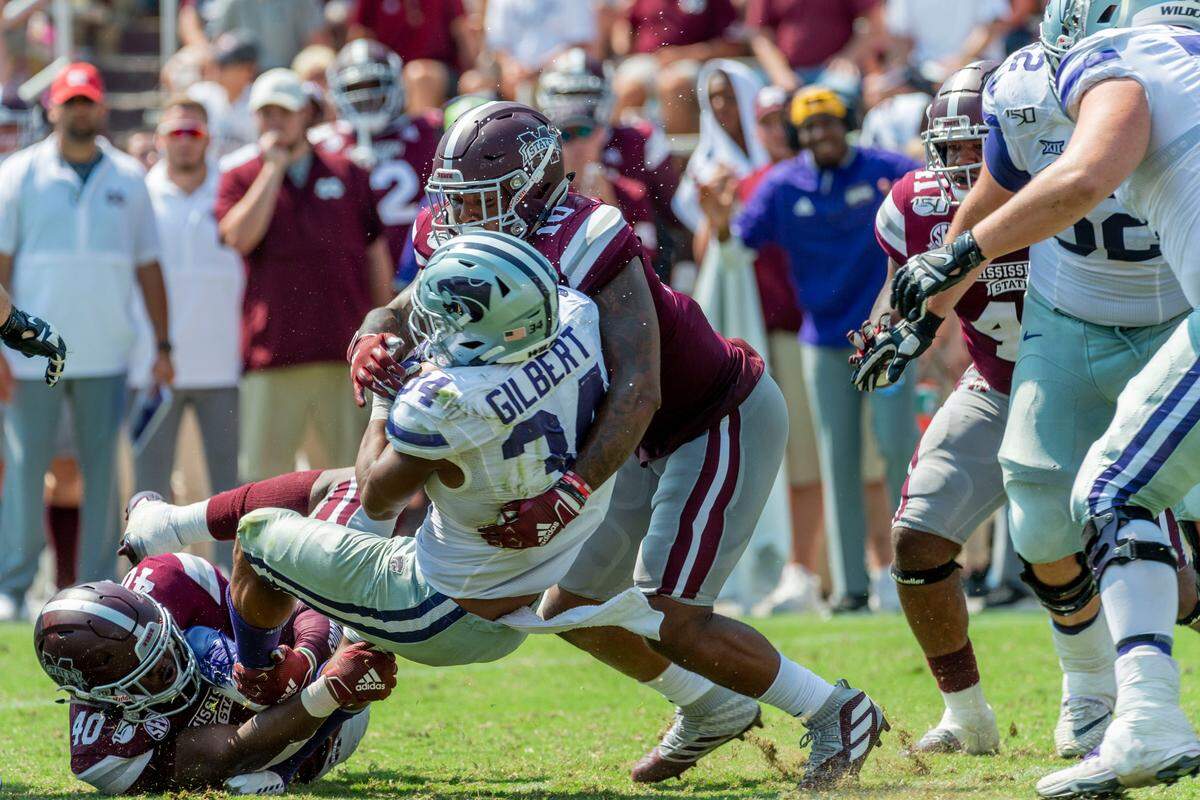 Mississippi State linebackers Erroll Thompson (40) and Leo Lewis (10) each have 23 tackles this season. They combined to wrap up Kansas State running back James Gilbert (34) during MSU’s 31-24 loss to KSU last week.