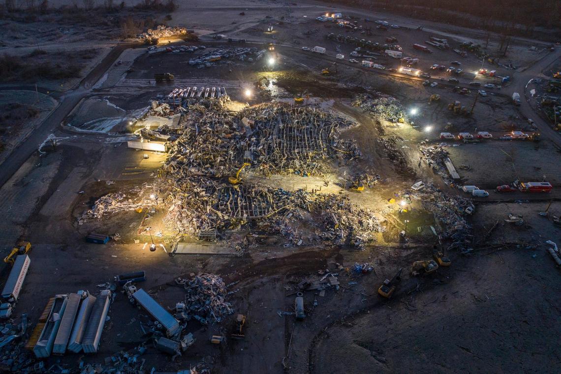 Search and rescue crews work at the Mayfield Consumer Products candle factory early Sunday, Dec. 12, 2021. A tornado traveled through the region Friday night.