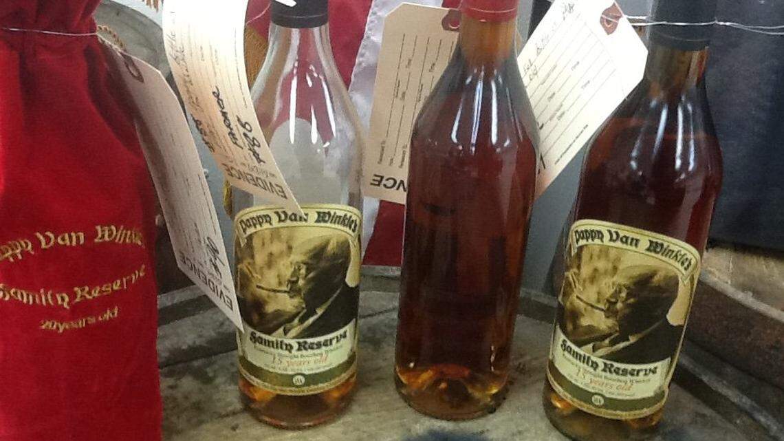 Recovered Pappy Van Winkle bourbon was displayed at the Franklin County Sheriff's Office during the announcement that nine people have been indicted as alleged members of a whiskey-theft ring that stole rare Pappy Van Winkle and other kinds of bourbon.
