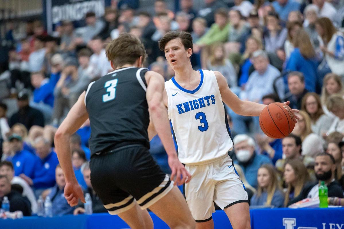 Lexington Catholic’s Tyler Doyle (3) sized up North Oldham’s Ian Higdon (3) during the championship game at the White, Greer & Maggard Holiday Classic at Lexington Catholic on Friday. Doyle, a transfer from Woodford County, was named tournament MVP.