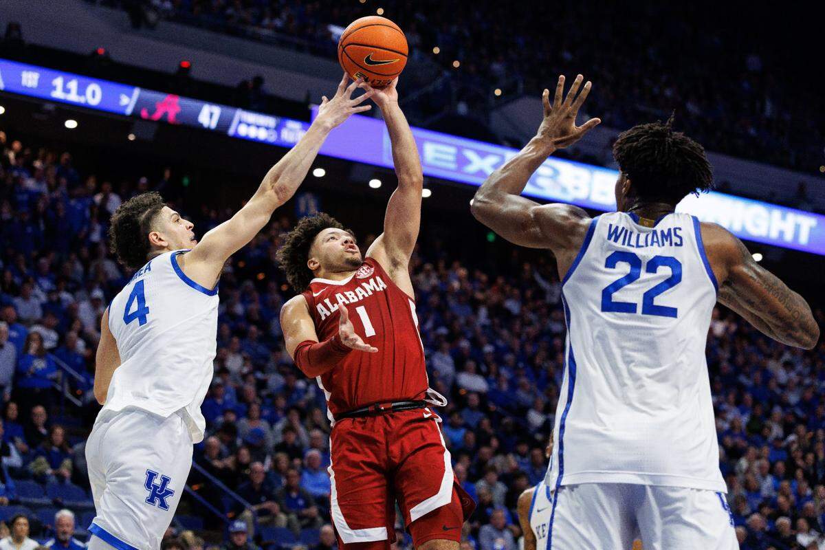 Alabama’s Mark Sears (1) shot over Kentucky’s Koby Brea (4) and Amari Williams (22) during the Crimson Tide’s 102-97 win over the Wildcats on Jan. 18. Sears had 24 points and nine assists in the win.
