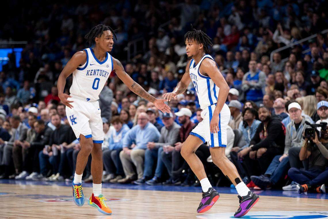 Kentucky guards Rob Dillingham (0) and D.J. Wagner (21) celebrate after a play against North Carolina during the CBS Sports Classic at State Farm Arena in Atlanta.