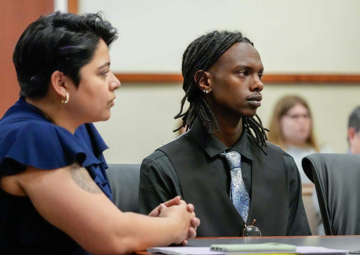 Jonah Bevin, right, and one of his lawyers, Melina Hettiaratchi, listen during a court hearing in Louisville, March 25, 2025.