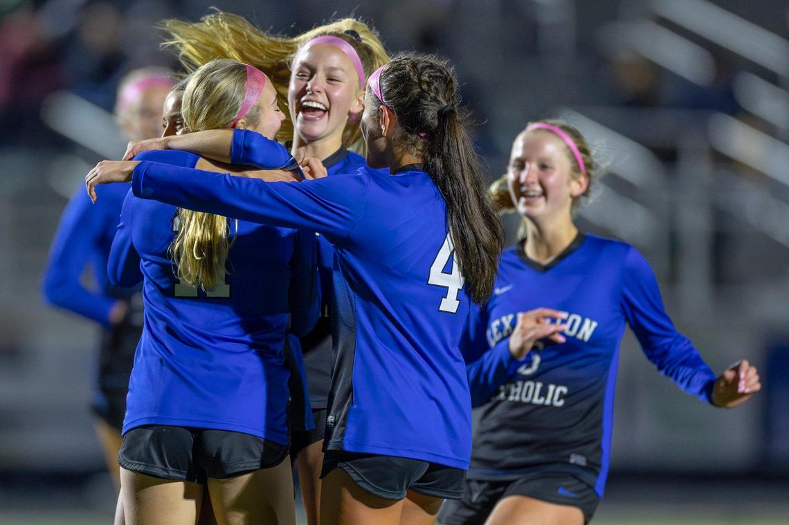 Lexington Catholic’s Ryan Cornelius (11) is congratulated by her teammates after scoring a goal in a game against Henry Clay during the girls 11th Region tournament semifinals at Franklin County High School on Oct. 17.