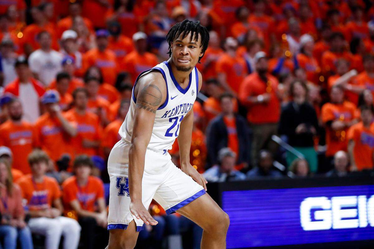 Kentucky guard D.J. Wagner celebrates scoring against Florida forward Alex Condon during Saturday’s game in Gainesville.