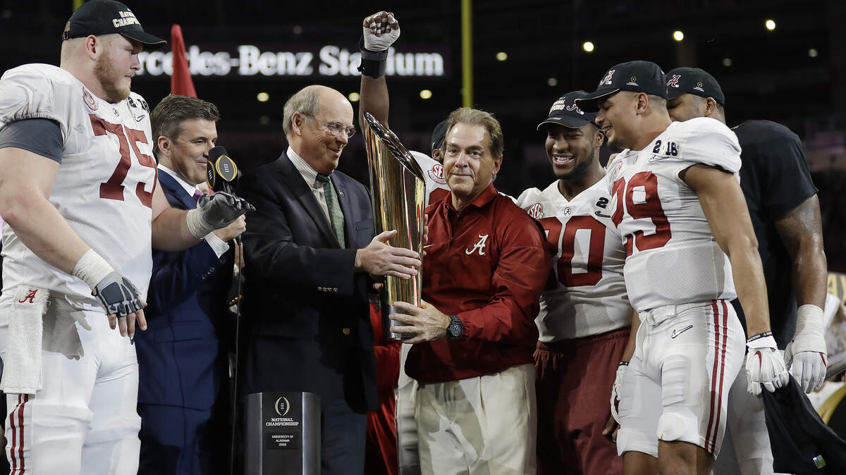 Alabama head coach Nick Saban held up the championship trophy after overtime of the College Football Playoff championship game against Georgia on Jan. 8, 2018, in Atlanta. Alabama won 26-23. Central Florida also laid claim to being "national champions" for last season after its 13-0 record.