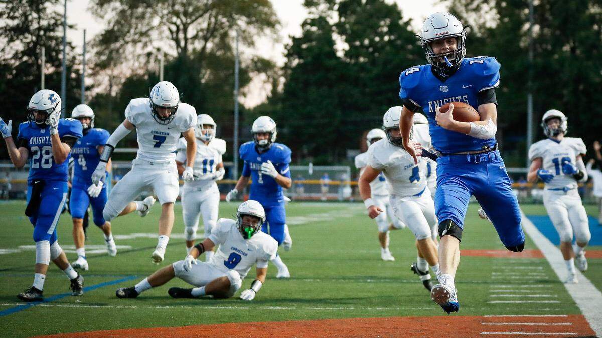 Lexington Catholic’s Jack Gohmann (14) scored a touchdown during last season’s game against Lexington Christian. Gohmann, now a senior, will lead the Knights against LCA on Friday night.