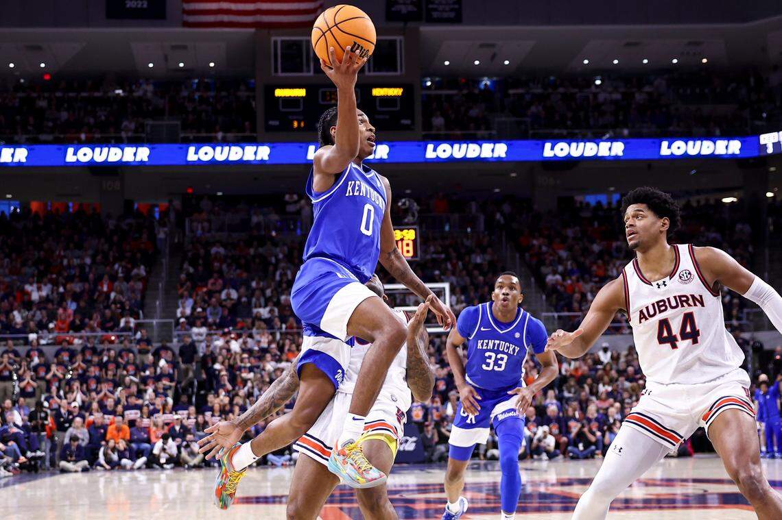 Kentucky guard Rob Dillingham (0) drives to the basket against Auburn center Dylan Cardwell (44) during Saturday’s game.