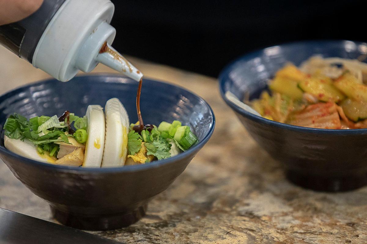 Atomic Ramen serves bao buns at the eatery’s location at The 90 on the University of Kentucky campus. It’s one of several local restaurants recruited by Aramark to serve to students, faculty and staff.