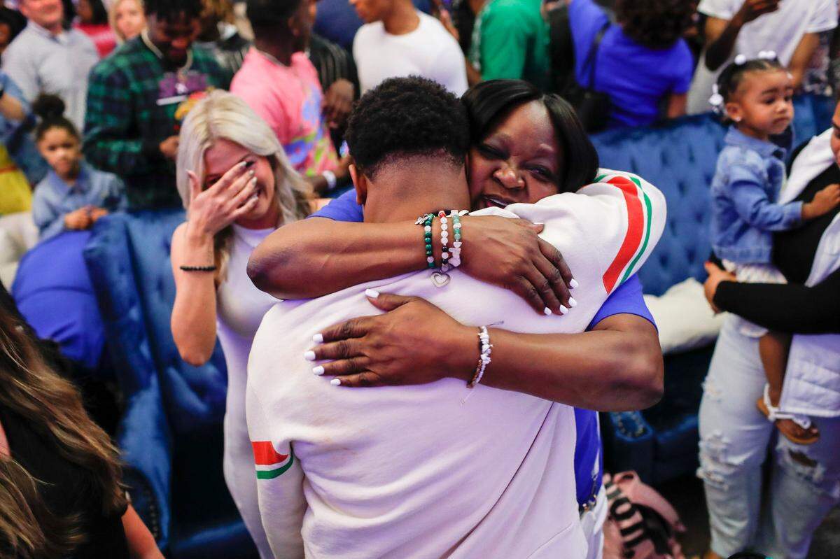 Former UK star wide receiver Wan’Dale Robinson celebrates with his family and friends during a watch party at the Griffin Gate Marriott in Lexington on Friday night after he became the 43rd pick of the 2022 NFL Draft.