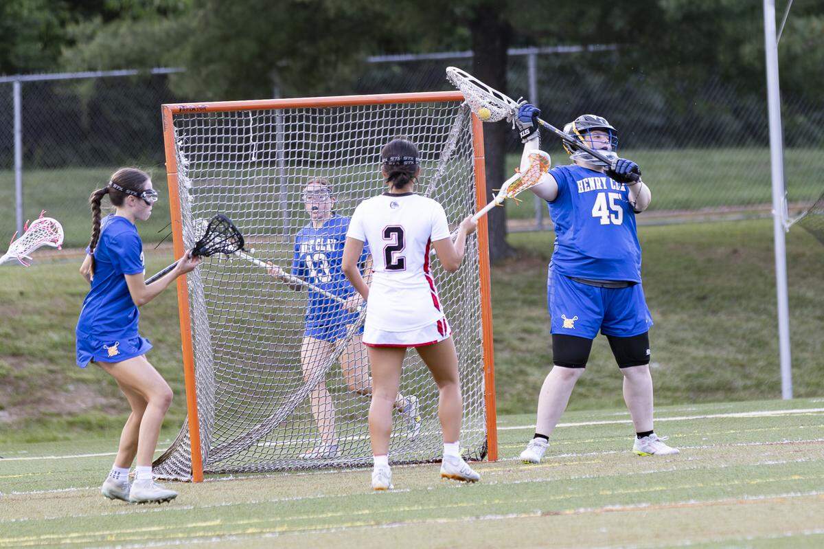 Henry Clay goalkeeper Rhea Combs (45) collects a save during the Blue Devils’ 10-3 win at Paul Laurence Dunbar High School on Monday.