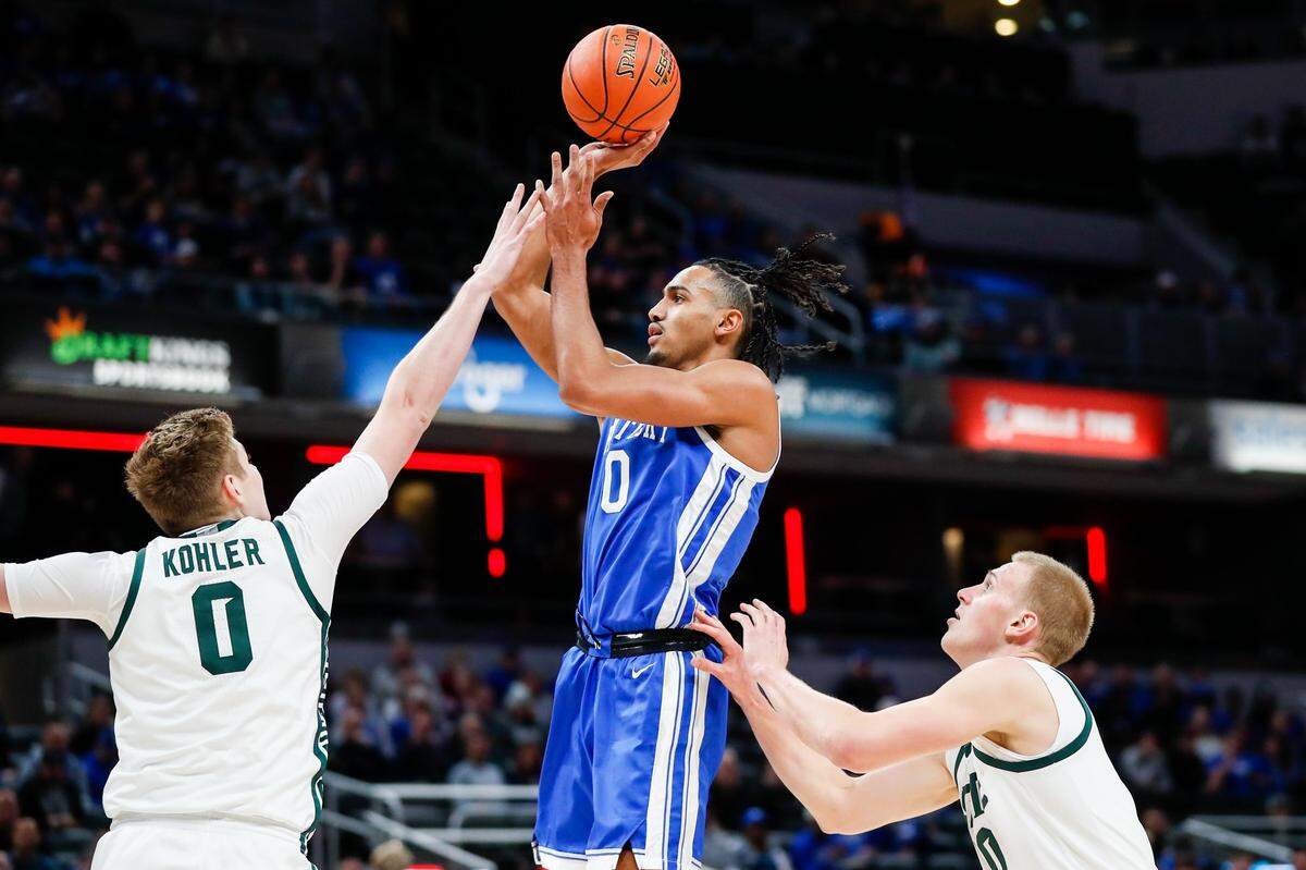 Kentucky’s Jacob Toppin, center, takes a shot against Michigan State on Tuesday, Nov. 15, 2022, in Indianapolis.