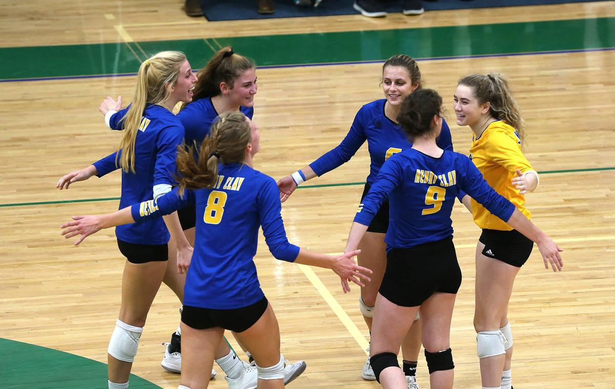 Henry Clay players celebrated a point won Tuesday against Scott County in the semifinals of the 42nd District volleyball tournament at Bryan Station.