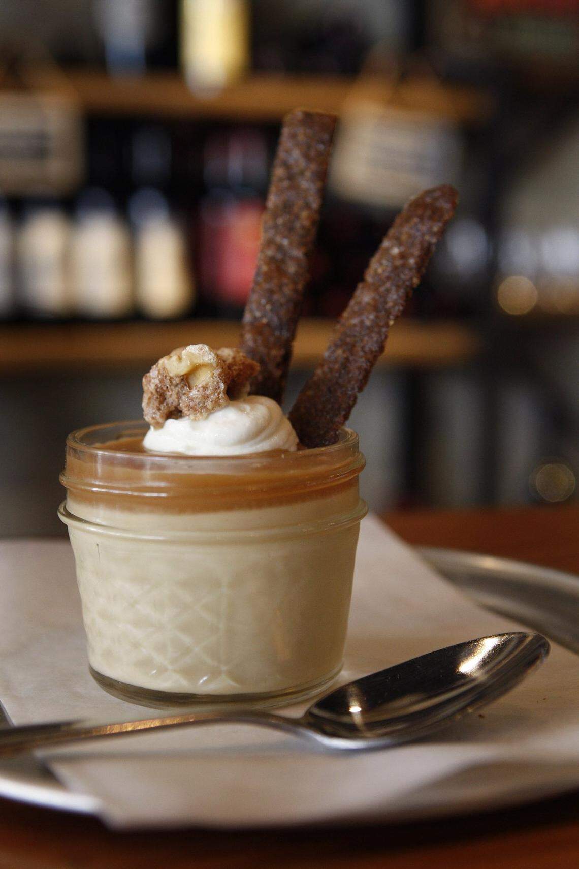 Butterscotch budino is a jar full full of ricotta chantilly, spiced walnut, salted caramel with bourbon smoked sugar cookies at crust in Lexington, Ky., Tuesday, November 11, 2014. Photo by Matt Goins