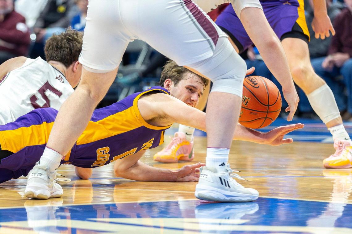 Lyon County’s Travis Perry (11) dives for a ball during Wednesday’s game. Kentucky’s Mr. Basketball scored 16 points to go along with five rebounds and five assists on his future home floor but had a tough shooting day.