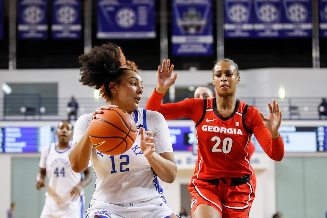 Kentucky’s Treasure Hunt (12) tries to score against Georgia’s Jordan Isaacs (20) on Thursday night. Hunt finished with eight points, three rebounds, three assists, one block and one steal.