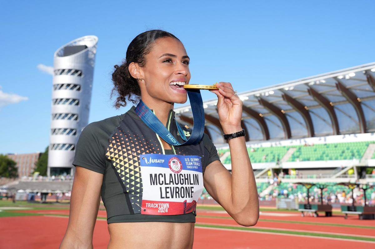Jun 30, 2024; Eugene, OR, USA; Sydney McLaughlin-Levrone poses with gold medal after winning the women's 400m hurdles in a world record 50.65 during the US Olympic Team Trials at Hayward Field. Mandatory Credit: Kirby Lee-USA TODAY Sports