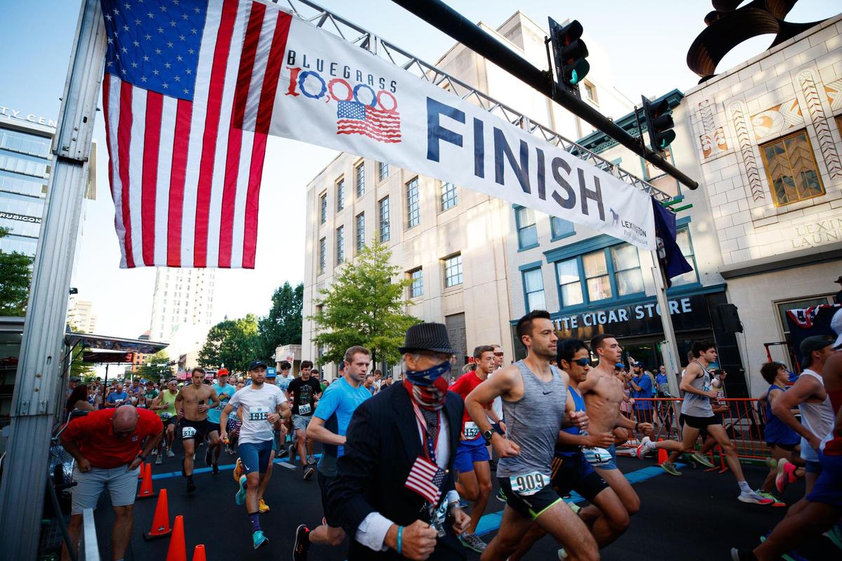 Runners start the Bluegrass 10,000 race on Monday in downtown Lexington. According to the online race results, there were 1,648 in-person runners who recorded a time.