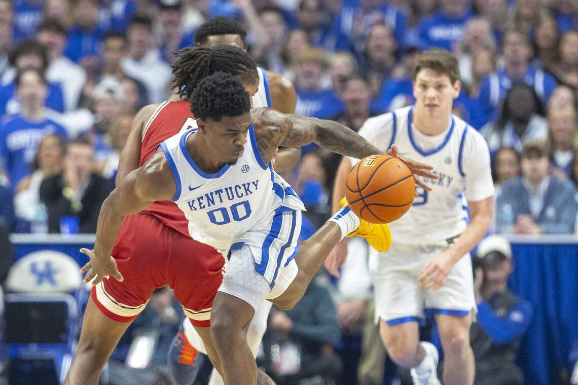 Kentucky guard Otega Oweh (00) steals the ball from Nicholls forward Sincere Malone (5) during Tuesday’s game at Rupp Arena.