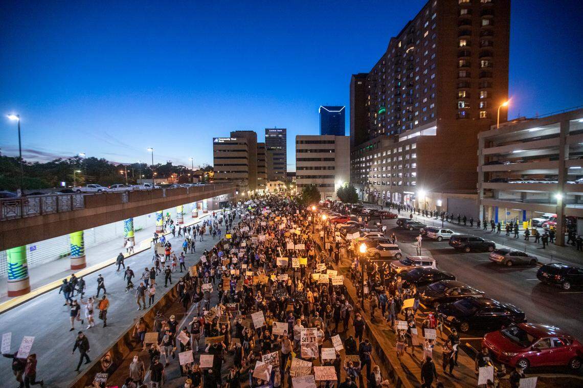 Protesters walk down East Vine Street in Lexington, Ky., during a rally against the deaths of George Floyd and Breonna Taylor on Sunday, May 31, 2020.