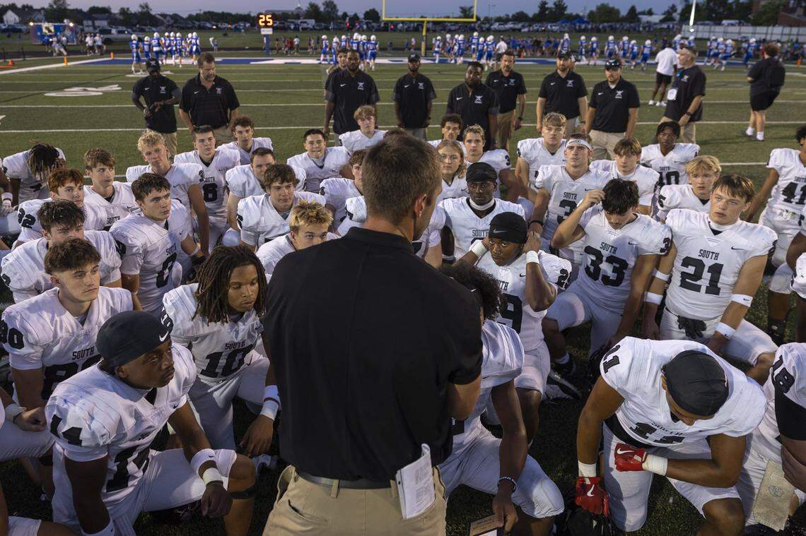 South Warren head coach Brandon Smith talks to his team following its eCampus.Com Bowl win over Bryan Station at Lexington Christian Academy on Aug. 22.