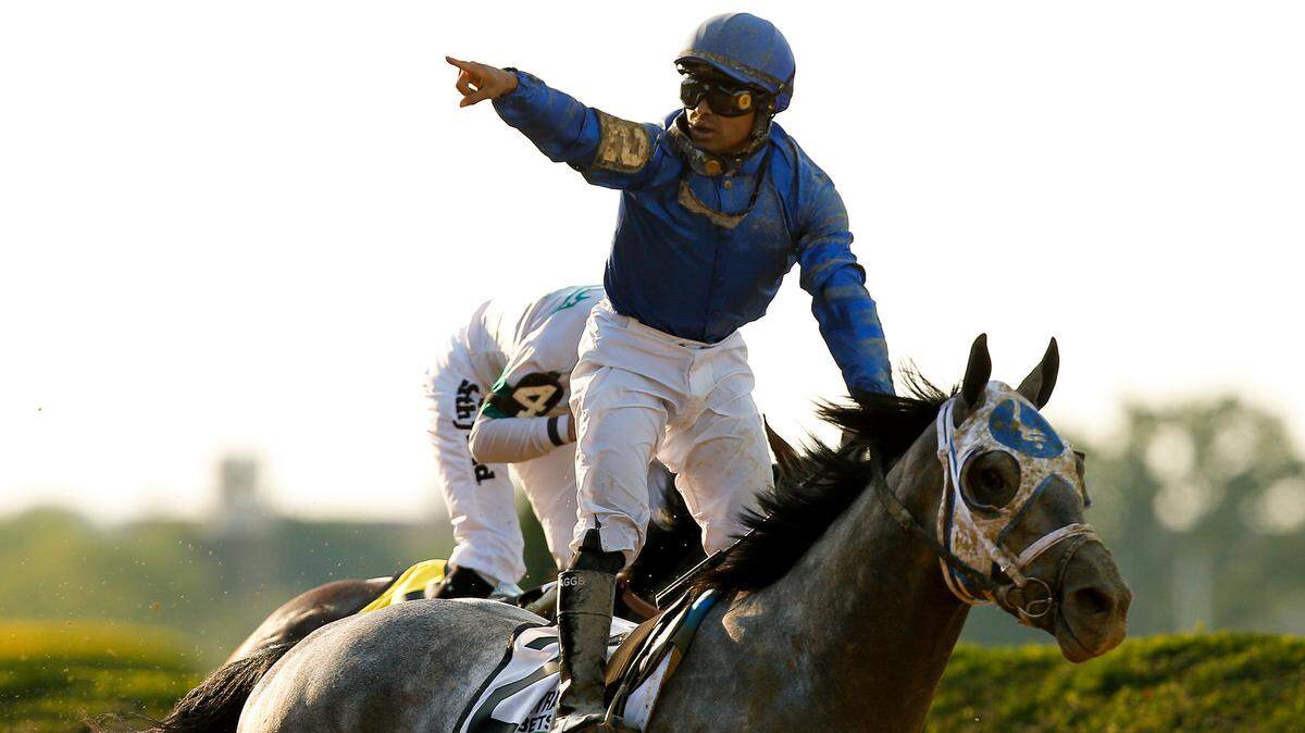 Jockey Luis Saez reacts after crossing the finish line atop Essential Quality (2) to win the 153rd running of the Belmont Stakes at Belmont Park in Elmont, N.Y., on Saturday.