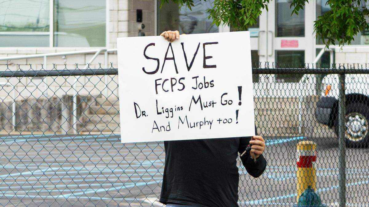 On May 5, 2026, school union members organized a demonstration in front of the Fayette County Public Schools Warehouse on Russell Cave in Lexington, Ky, protesting against financial cuts being made by FCPS officials. A protester held a “Save FCPS Jobs” sign, stating that Fayette County Public Schools (FCPS) Superintendent Dr. Demetrus Liggins and FCPS Chair Tyler Murphy must go.